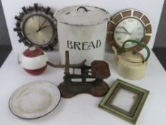 An enamelled bread bin, balance scales, enamelled dish, clocks, etc.