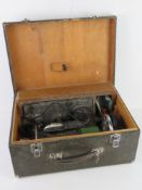 A Singer sewing machine in original case with Singer rubberised mat and cardboard box of