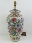 A ceramic table lamp in the style of a Chinese ginger jar having Iris and other floral design upon,