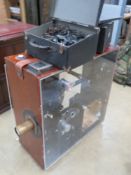 A magic Lantern projector in wooden case with perspex sides for display, 77.5cm high, 75cm wide.