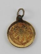 An 18ct gold Scorpio charm, 12mm dia, 0.58g.