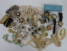 A quantity of assorted costume jewellery and wristwatches.