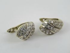 A pair of 14ct gold earrings set with white stones, stamped 585, 4.23g.