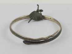 A white metal and niello work upper arm bangle in the form of a snake, approx 7.3 int dia.