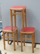 Three vintage leatherette topped stools, each 53cm high.