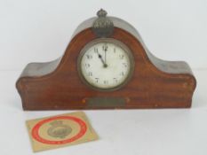 A mantle clock bearing Metropolitan Special Constabulary badge upon,