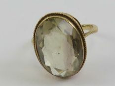 A 9ct gold citrine cocktail ring, the oval faceted stone approx 7.67ct (18 x 12 x 6.