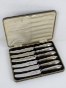 A set of HM silver handled butter knives in original fitted case, steel blades marked for Viners.