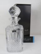 A Stuart crystal decanter in original box.