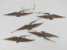 A delightful Oriental carved wood mobile in the form of flying cranes.