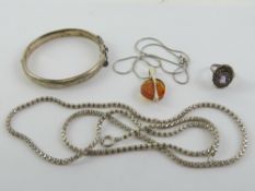 A silver and Baltic amber pendant on chain, together with a HM silver hinged bangle,