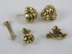 A quantity of 9ct gold and yellow metal jewellery, 2.2g.