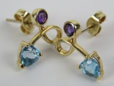 A pair of 14ct gold earrings set with aquamarine and amethyst, stamped 14K, 1.9g.