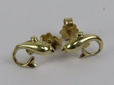 A pair of dolphin earrings, 14ct gold butterfly backs, no apparent hallmarks on earrings, 1.7g.