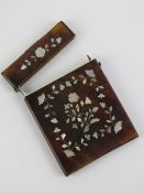 A delightful card case inlaid with bone and mother of pearl, a/f, 7.7cm wide.