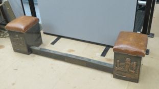 A fire surround comprising two leatherette stools opening to reveal compartment within and