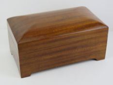 A large and impressive jewellery box opening to reveal red lined compartment, 34cm wide.