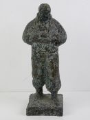 An impressionist influence sculpture of a male figure dated 9.1.'59 to one side and 9.1.