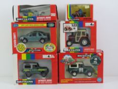 A quantity of boxed Britains vehicles; Massey Feruson MF362 tractor, National Trust Land Rover,