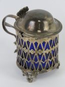A George III silver mustard having pieced sides with Bristol blue glass liner,