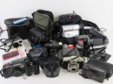 A Kodak Brownie 44B camera together with other assorted photography equipment