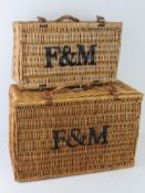 A pair of graduated Fortnum and Mason's picnic basket hampers. Largest approx 52 x 34 x 24cm.