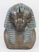 A large plaster bust of an Egyptian Pharaoh painted in blues and gold, 32cm high.