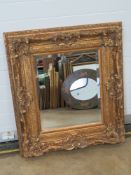 A large and impressive contemporary gold painted mirror, bevelled edge glass, 98 x 88cm.