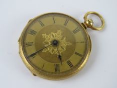 An 18ct gold ladies fob watch, open face with yellow metal dial and blued steel hands,