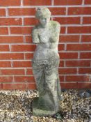 A pre-cast Classical style female partial nude statue, 86cm high.