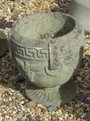A pre-cast Greek key Bacchus style urn planter, 27cm high, 23cm wide.