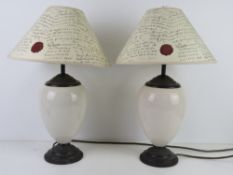 A pair of Laura Ashley ceramic table lamps with Laura Ashley paper shades.
