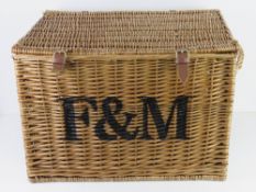 A large coffee table sized Fortnum & Masons wicker hamper, 57 x 40 x 40cm.