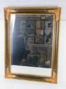 A contemporary bevelled edged glass mirror by Bright's of Nettlebed measuring 62 x 83.5 overall.