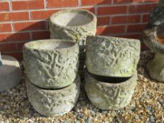 A set of six pre-cast stone planters having fruiting plant design upon, 29cm dia, 21.5cm high.