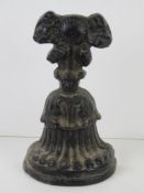 A cast iron door stop standing 20.