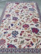 A Society Tappeti Italian cotton rug with floral design on cream ground,