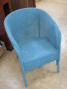 An original Lloyd Loom Lusty wicker tub style chair in turquoise blue having original label upon.