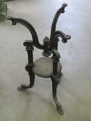 A cast iron pub table base having patent number upon.