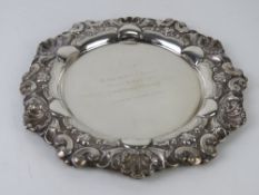 A white metal salver, no apparent hallmarks,
