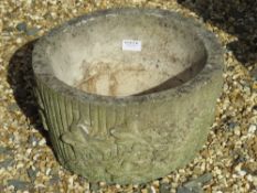 A single pre-cast planter having ivy design upon, 37.5cm dia, 23.5cm high.