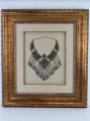 A large and impressive white metal North African necklace on silken mount within gold painted frame