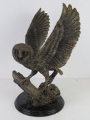 Contemporary resin sculpture of an owl about to take flight 39cm high