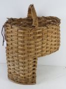 A wicker 'stairs' basket having loop handle over.