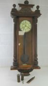 A Vienna 30 hour wall clock with weights and pendulum, enamel dial, for simple restoration.