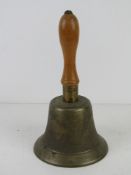 A brass hand bell marked Fiddian having turned wooden handle.