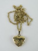 A 9ct gold heart shaped locket on a 9ct gold fancy link chain, 2.3g.