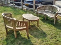 A matched pair of wooden kidney shaped garden benches,