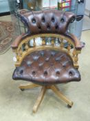 A contemporary 'Captains' office chair in brown.