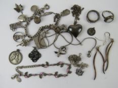 A quantity of assorted silevr and white metal jewellery including a charm bracelet, 74.1g.